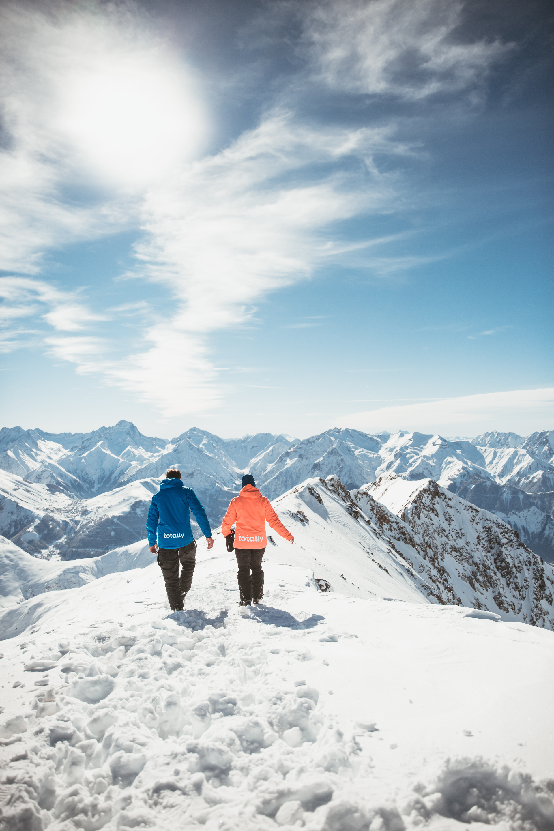 People Walking On Snow Covered Mountain